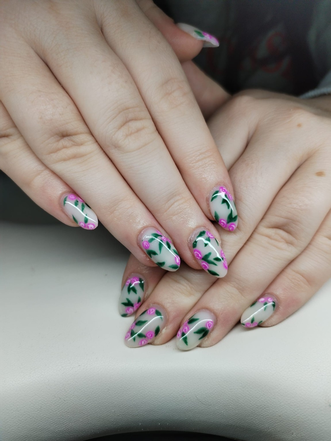 Hand-painted pink floral nail art by Moy Nails