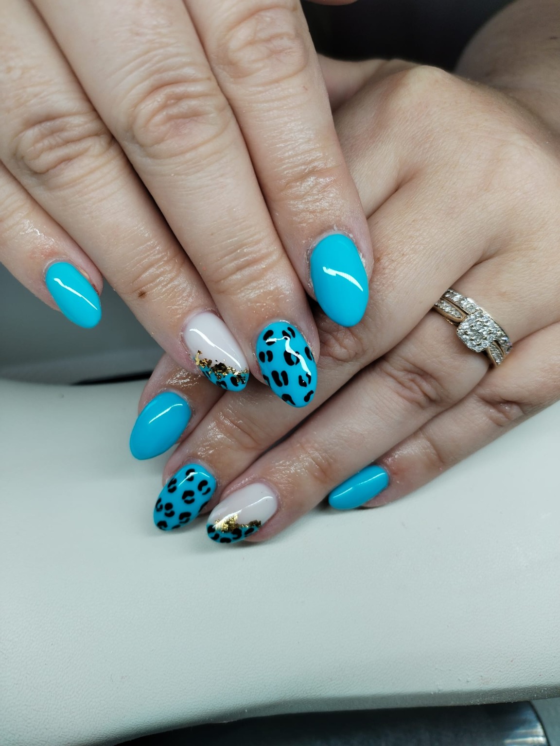 Blue animal print nail art with gold detail by Moy Nails