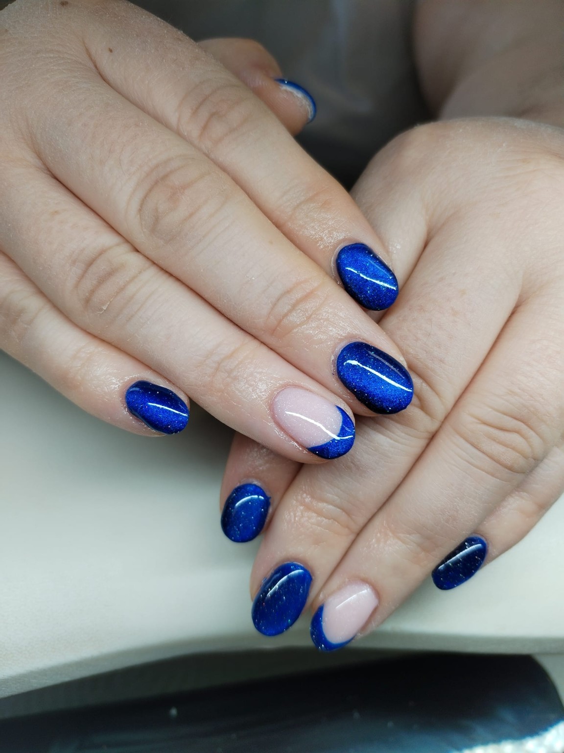 Deep blue shimmer manicure with accent tips by Moy Nails