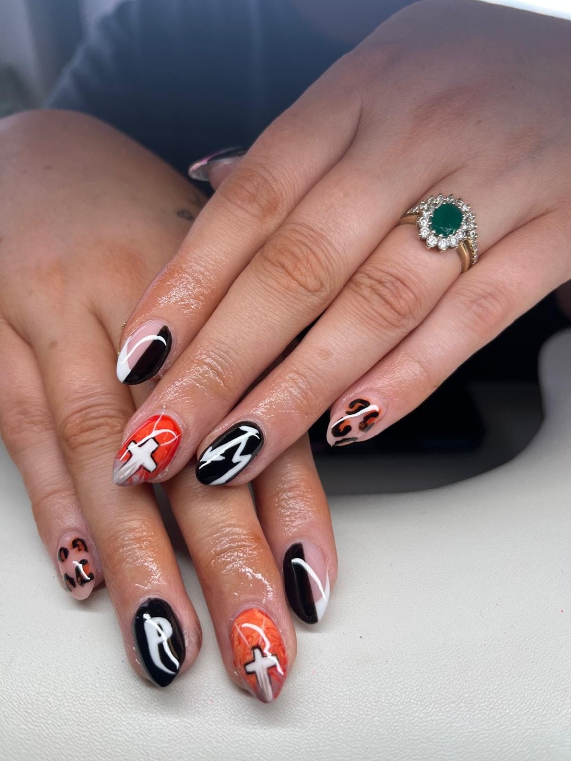 Black, orange and animal-print nail art by Moy Nails